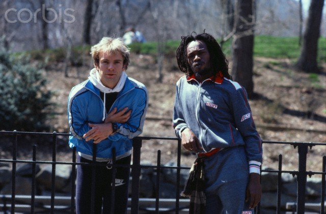 Sting and Michael Rose Leaning on a Fence