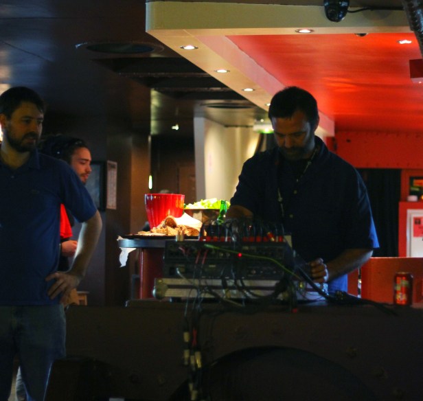 Patleg, sound engineer, setting up the desk, inside the boat - Photo : Fred reGGaeLover 2014