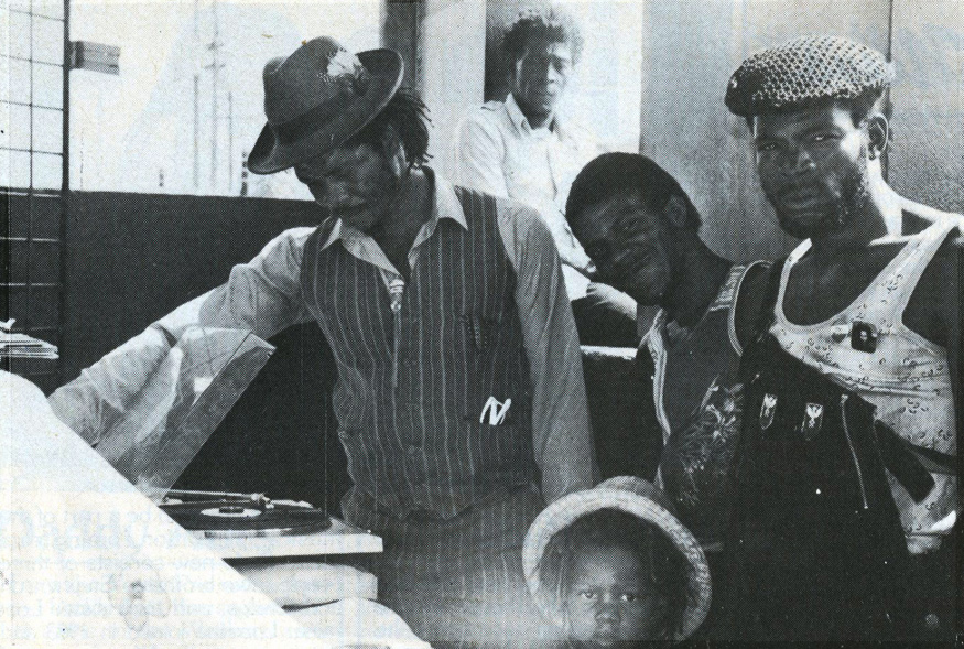 tumblr_mt2jlcCIGm1qzhoqfo1_1280     Jazzbo (left) plays 45s outside his Olympic Way HQ with Joe Lickshot (right) and Jazzbo Junior. Photo by Beth Lesser.